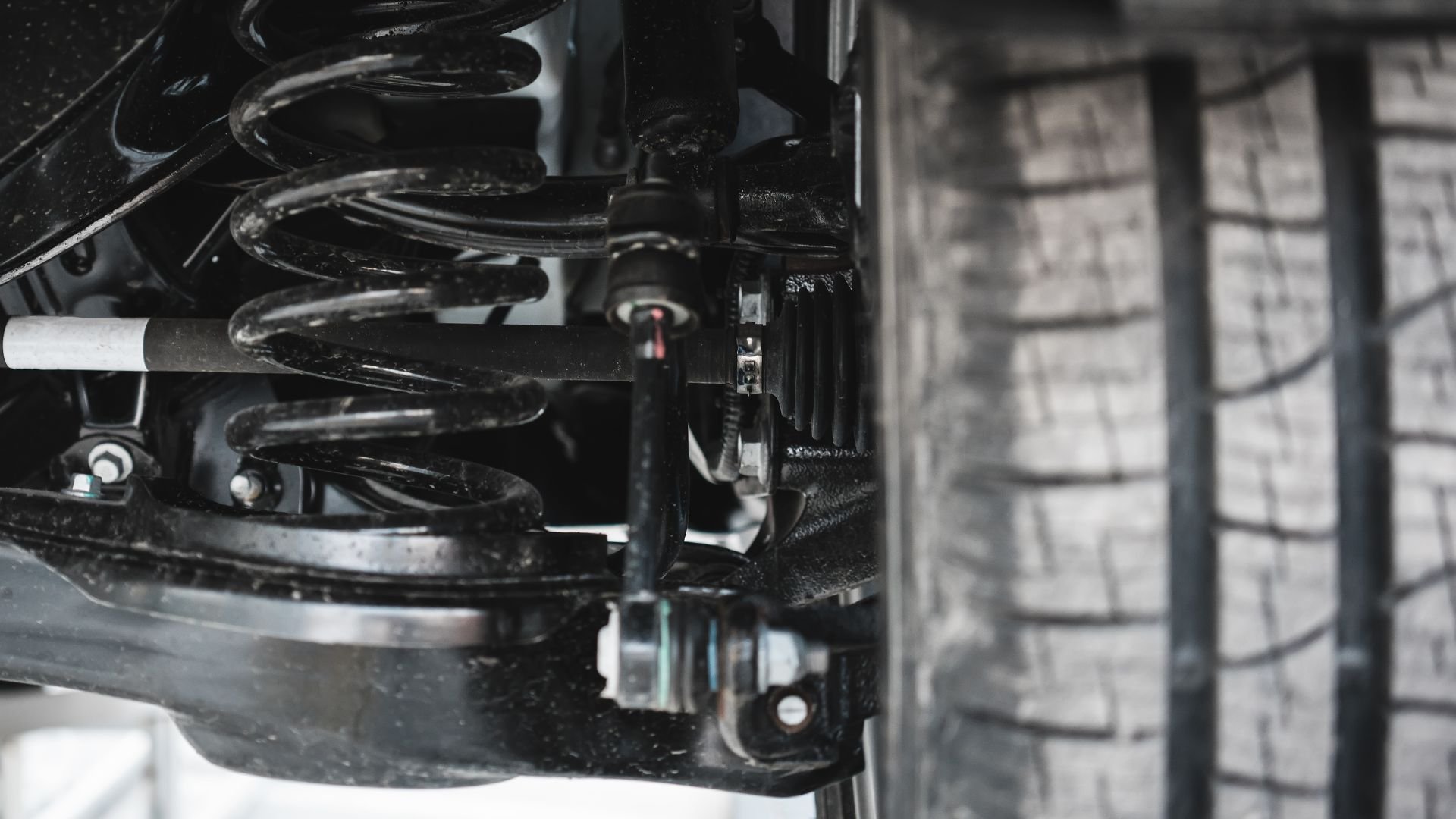 Car suspension system with coil spring and shock absorber details
